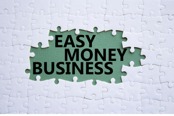 Easy Money Business symbol. Concept words Easy Money Business on white puzzle. Beautiful grey green...