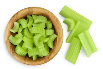 fresh celery in wooden bowl isolated on white background. Top view. Flat lay