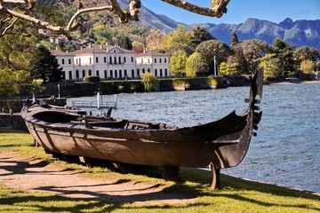 A wooden boat in the gardens of Villa Melzi.