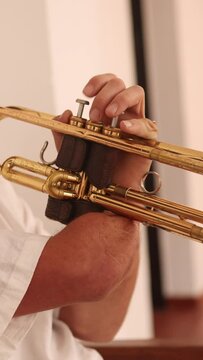 Inspiring one-armed trumpeter refining skills at home