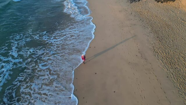 Muslim woman enjoying solitude on a serene beach
