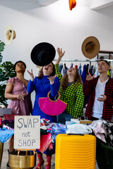 Swap party, garage sale - clothing exchange between college friends. Hats, bags, dress, jeans,...