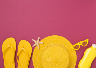 Flat lay with yellow summer outfit on color background. Vacation concept