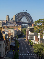 Sydney Harbour Bridge seen over the city streets