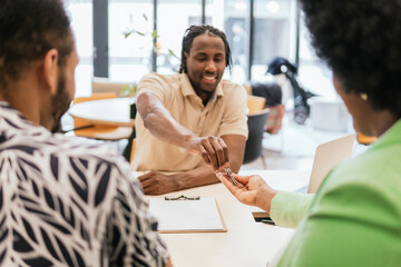 Handing over keys in a modern coworking office space