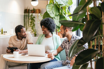 Diverse Team Engaged in Discussion at Coworking Space