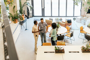 Modern coworking space with diverse team interacting