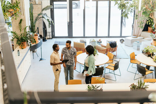 Professionals interacting in a modern coworking space