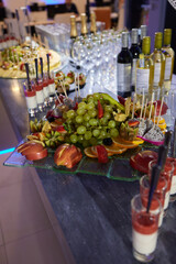 light snacks for the holiday, catering. Various light snacks. Catering plate. Assortment of sandwiches on the buffet table. meat, fish, vegetable canapes.
