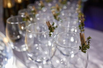 Table with champagne stemware and man in background at event