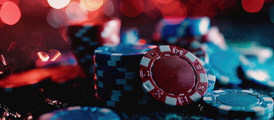 Close-up poker chips at a casino table, copy space. Creative background for casino, colored coins in a stack.