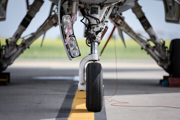 Fighter aircraft in parking position. Detail with landing gear.