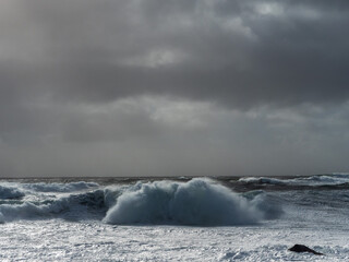 Powerful ocean wave hit rough stone coast in Doolin pier area, county Clare, Ireland. Stunning...