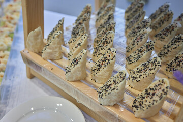 light snacks for the holiday, catering. Various light snacks. Catering plate. Assortment of sandwiches on the buffet table. meat, fish, vegetable canapes.