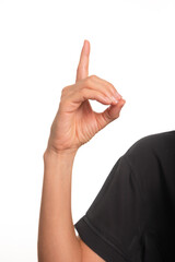 Close-up of a female arm and hand making the letter D in the Brazilian sign language for the deaf, Libras.