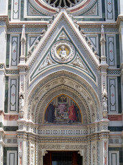 Obraz premium Florence Duomo left portal detail with mosaic of “Charity among the Founders of Florentine Philanthropic Foundations” by Niccolo Barabino