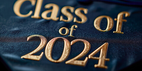 Class of 2024 letters in gold color on black fabric, graduation