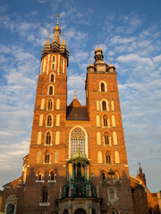 The sunset light on the two different towers of St Mary's Basilica, Krakow
