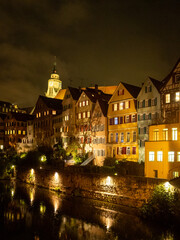 Fototapeta na wymiar Night shot of Tübingen buildings by Neckar river