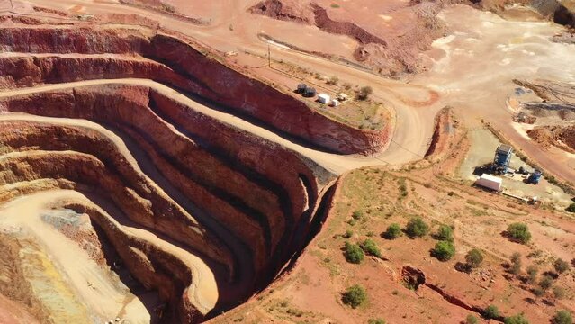 Wide aerial top down view of open pit copper mine in Cobar town of Australia.

