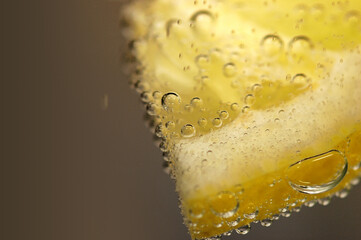 A lemon slice in sparkling water: A refreshing blend of citrus and effervescence, offering a...
