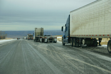 Trucks stop to remove chains