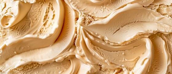 Dulce de leche flavor gelato - full frame background detail. Close up of a beige surface texture of...