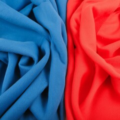 Red and blue fabric material draped and intertwined with each other