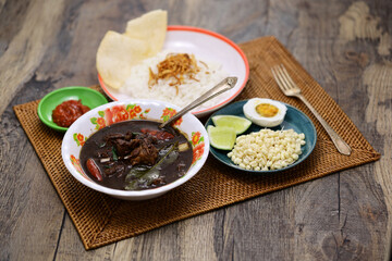 nasi rawon, black beef soup with rice.  Indonesian cuisine.