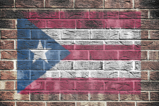 Puerto Rico flag on old brick wall background