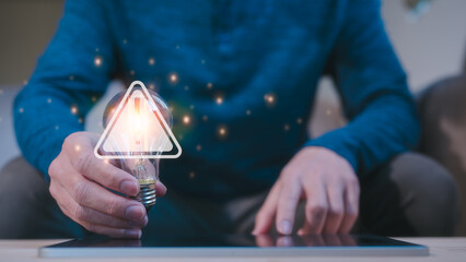 Risk management Ransomware malware attack data breach. System hacked spam virus with warning caution notification on internet security. man holding light bulb with triangle warning sign