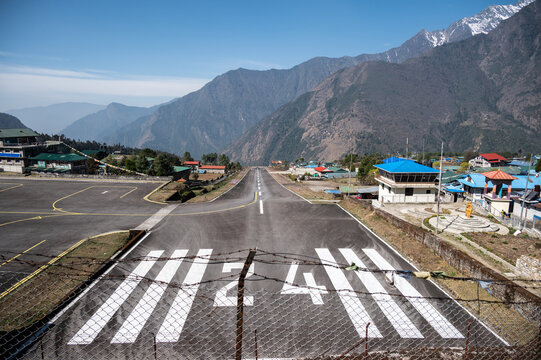 Beautiful view of Lukla airport one of the most dangerous airport in the world in Nepal. The runway rests on a hillside in the town of Lukla, Nepal.