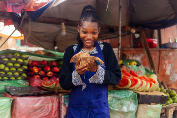 Excited African Fruit Merchant Holding Cash - Colorful Fruit Background