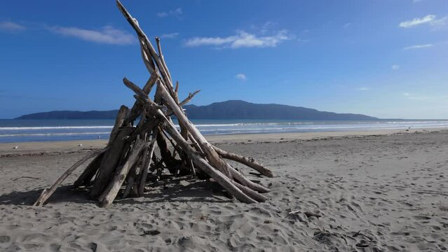 Driftwood sculpture with a view to Kapiti Island. Paraparaumu, Wellington, New Zealand.