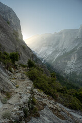 Fototapeta na wymiar Snow Creek Trail Climbs The Granite Walls Toward The Morning Sun