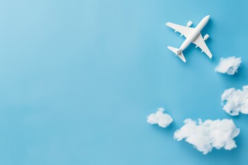 Model airplane with clouds on blue background.