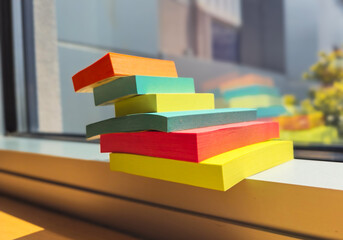 Colorful stacked sticky notes in office