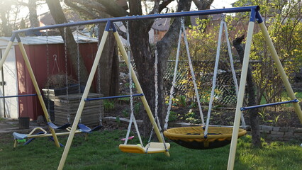 The swing seat is often constructed from durable materials like plastic or wood and comes in...