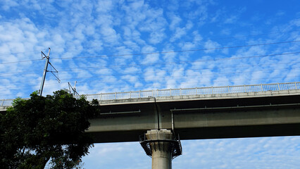 high speed rail, fast railway bridge with blue sky and clouds
