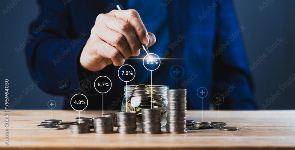 Poster a man is pointing at a growing value number from stacked coins