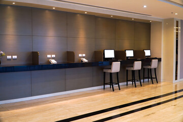 Hotel interior with rows of computer monitors and seats,Lounge design concept for customers