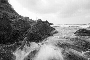 Long exposure black and white photos of coastline scenery.