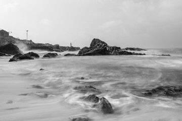 Long exposure black and white photos of coastline scenery.