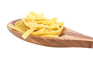 Fettuccine pasta in a wooden spoon isolated on a white background