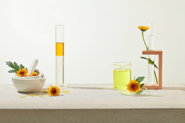 Minimal concept with fresh calendula flower decorated for advertising cosmetic product. Calendula petal contains skin-soothing compounds. Front view, space for design