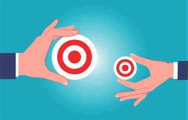 Big target vs. small target, task or goal, one hand holding a big target and the other hand holding a small target