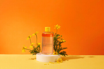 Mockup scene with a cosmetic bottle unlabeled displayed on white podium with fresh calendula flower...