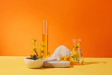 Abstract minimal scene - empty brick podiums decorated with erlenmeyer flask, test tube and fresh calendula flowers on orange background. Space for display cosmetic product and text. - obrazy, fototapety, plakaty