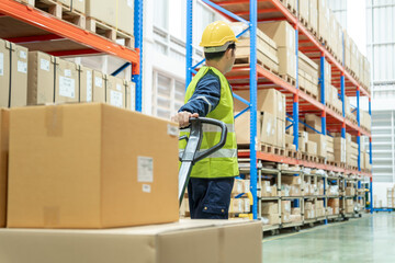 Warehouse worker pull pallet truck after inspects goods in inventory and check stock product. Transport logistic business shipping and delivery to customers.  inspection, storehouse, storage, factory © Shisu_ka