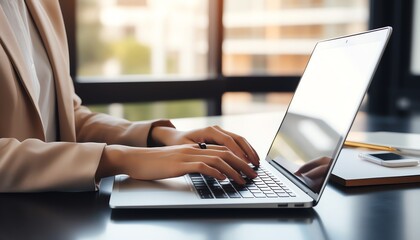 Fototapeta premium Closeup of businesswomans hands typing financial report on laptop, modern office background
